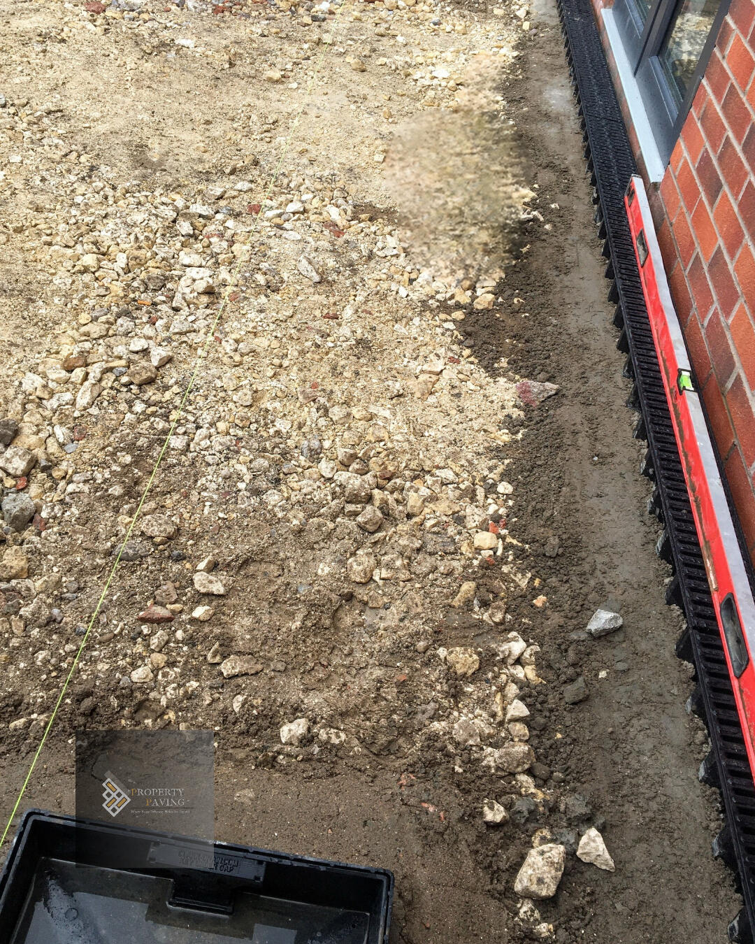 Drainage installation before paving Drainage installation set to correct falls before paving work begins